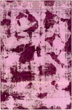 a pink rug with black and white designs on it's edges, in shades of purple