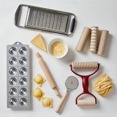 the ingredients are laid out on the table to be used for making pizzas and pies