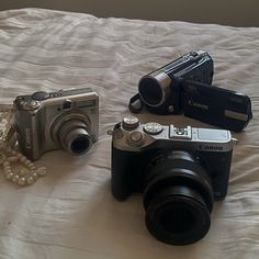 a camera and some other items on a bed