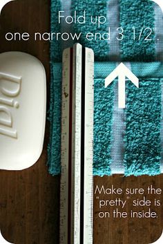 a close up of a bathroom rug next to a soap dispenser and ruler