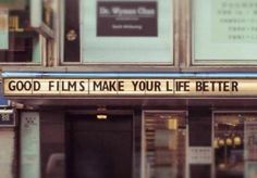 a sign that says good films make your life better on the outside of a building