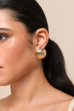 From casual after work cocktails to iconic VIP events, the Lulus Mesmerizing Radiance Gold Textured Circle Statement Earrings are here to help you impress! Shiny, gold-toned metal shapes these stunning earrings that have an oversized, round profile and a textured design of raised lines across the surface. Omega clips and post backs. Hoop Earring is 1. 25" Diameter. 100% Iron. Imported. Lulus | Mesmerizing Radiance Gold Textured Circle Statement Earrings. Round Profile, Jewellery Photography, Lulu Fashion, Textured Design, Jewelry Photography, Stunning Earrings, Accessories Jewelry Earrings, Gold Texture, Round Earrings