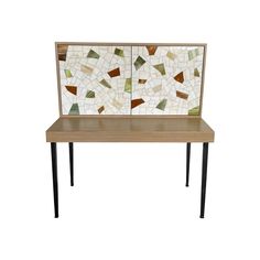 a wooden table topped with a mosaic tile back splash