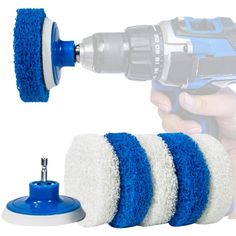 a blue and white brush attachment being used on a drill