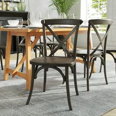 a dining room table with chairs around it