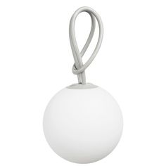 a white ball hanging from a metal hook on a string with a knot at the end