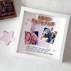 a photo frame with the words best friends on it next to a star shaped cookie