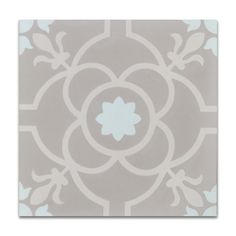 a gray and white tile with an intricate design on the bottom, in shades of light blue