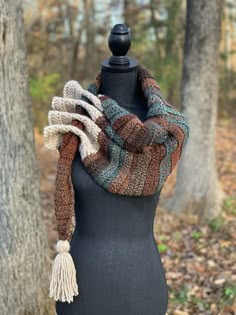 a mannequin wearing a multicolored scarf