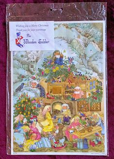 a christmas card with an image of children around the tree and presents under it on a purple background