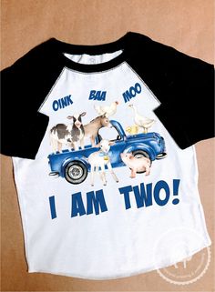 a t - shirt that says i am two with farm animals on the front and back