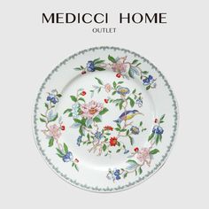 a white plate with flowers on it and the words medicoi home outlet