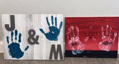 two handprints are displayed on wooden boards