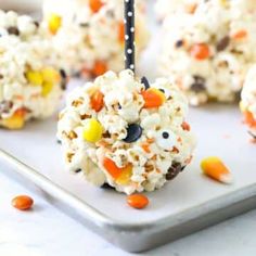 halloween popcorn balls on a plate with candy