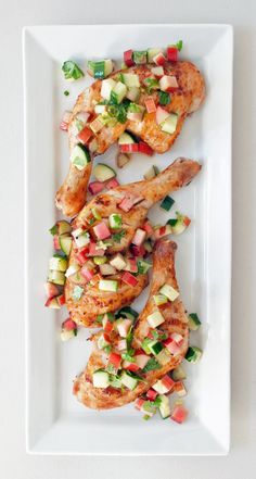 grilled chicken with vegetables on a white plate