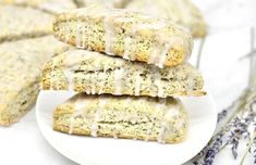 three scones on a plate with lavender sprinkles