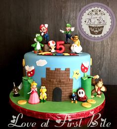 a birthday cake with mario and friends on it