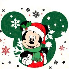 mickey mouse wearing a santa hat and scarf with snowflakes on it's back