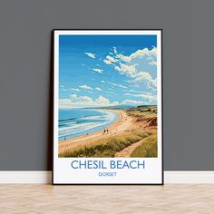 a poster with the words chesil beach in blue and white, on a wall next to a wooden floor