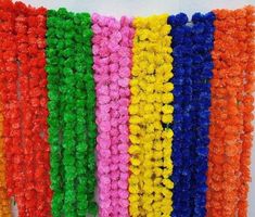 multicolored crochet garlands hanging on the wall