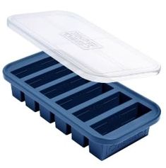 an empty plastic container sitting on top of a blue tray with dividers and lid