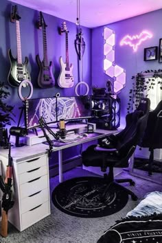 a room with guitars and other musical instruments on the wall, including an electric guitar