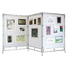 a white room divider with pictures on it