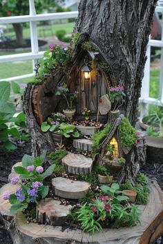 a tree stump with a house built into it