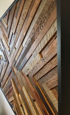 a wall made out of wooden planks in a room