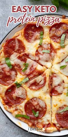 a pepperoni pizza cut into eight pieces on a plate with basil leaves and cheese