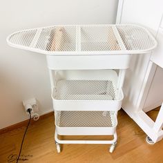 a white table with two baskets on it