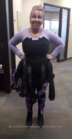 a woman dressed in costume poses for the camera with her hands on her hips and smiling