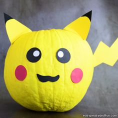 a yellow pumpkin decorated like a pikachu