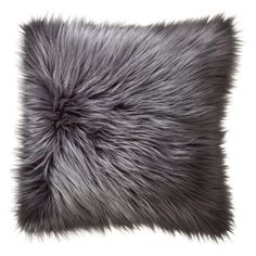 the grey fur pillow is on display in front of a white background with an inscription that reads