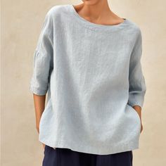 100% European Linen (Preshrunk) Top Pull-On Style That Is Casual Yet Sophisticated. It Has An Oversized Silhouette With Wide Round Neckline, Dropped Shoulders, Tailored 3/4 Sleeves, And A Slightly Arched Hem. Color Is A Light Blue. Machine Washable Gentle Cycle, Tumble Dry, Low Temperature Ironing Recommended. Equivalent To Size 12-14 Us, The Approximate Measurements Are: Shoulders: 32” Bust: 58.3” Ptp: 28.5” Waist: 56” Hips: 57” Overall Length: 24.25” Sleeve Length: 7.3” Condition Is New With T Light Blue Linen Casual Tops, Light Blue Crew Neck Blouse For Summer, Casual Light Blue Linen Tops, Effortless Blue Relaxed Fit Tops, Blue Plain Top For Workwear, Blue Plain Top For Work, Simple Long Sleeve Summer Tops, Blue Relaxed Fit Solid Top, Blue Relaxed Fit Solid Color Top