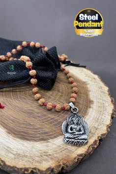 Experience the perfect blend of spirituality and modern design with our handmade adjustable rudraksha necklace, featuring a striking Buddha pendant crafted from high-quality stainless steel. This unique piece is meticulously designed by me, combining the ancient benefits of rudraksha with the durability and elegance of stainless steel. **Key Features - **Handmade and Unique Each necklace is handcrafted with care and attention to detail, ensuring a one-of-a-kind piece that embodies both beauty and spirituality. - **Adjustable Length The adjustable sliding design allows you to customize the length for a perfect fit, providing versatility for different styles and occasions. - **Rudraksha Beads Known for their spiritual and healing properties, rudraksha beads are believed to reduce stress, enh Rudraksha Necklace, Buddha Pendant, Healing Jewelry, Stainless Steel Pendant, Spiritual Healing, Stylish Accessories, Stone Pendants, Jewelry Gift