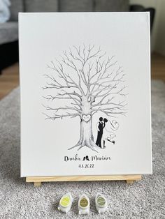 a couple under a tree with their wedding date stamp on the front and back side