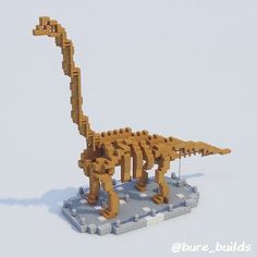 a lego model of a dinosaur made out of wood and plastic blocks on a white surface