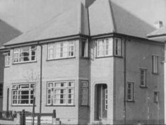 an old black and white photo of a house