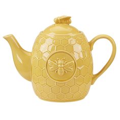 a yellow teapot with a bee on the front and honeycombs on the outside