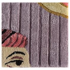 a close up of a rug with an image of a woman's face on it