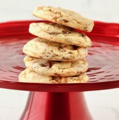 a stack of cookies sitting on top of a red plate