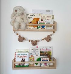 two wooden shelves with books and stuffed animals on them