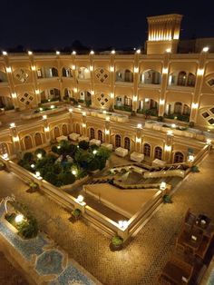 an aerial view of a large building at night