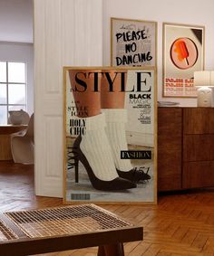 a magazine cover with high heeled shoes on display in a living room next to a coffee table