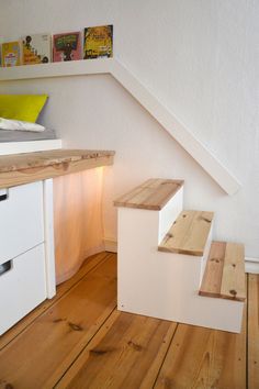 the stairs are made out of wood and white