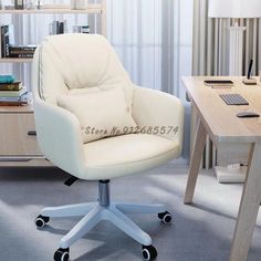 a white office chair sitting in front of a desk