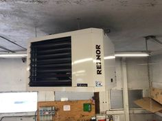 a large air conditioner sitting inside of a building