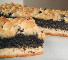 a close up of a cake on a plate with one slice missing from the cake