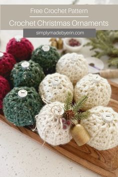 Red, Green, Cream and Gold, Crochet Christmas Ornaments adorned with a gold bell, red berries, greenery, pinecone, and twine bow, displayed on a wooden tray Crochet Christmas Ornament Pattern, Crochet Planter Cover, Yarn Decor, Crochet Towel Holders, Fun Gift Ideas, Modern Christmas Ornaments, Crochet Stocking